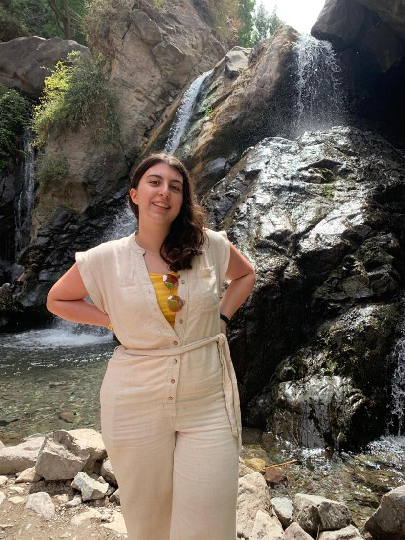 Picture of Ilenia in front of a waterfall